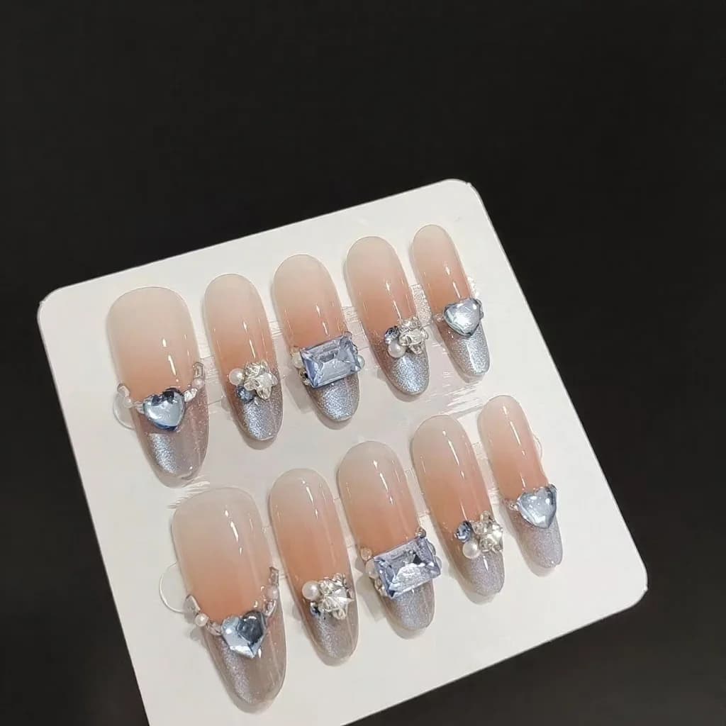 Blå bärnsten Cat Eye Press-on-naglar Fransk tip Strass Lång oval