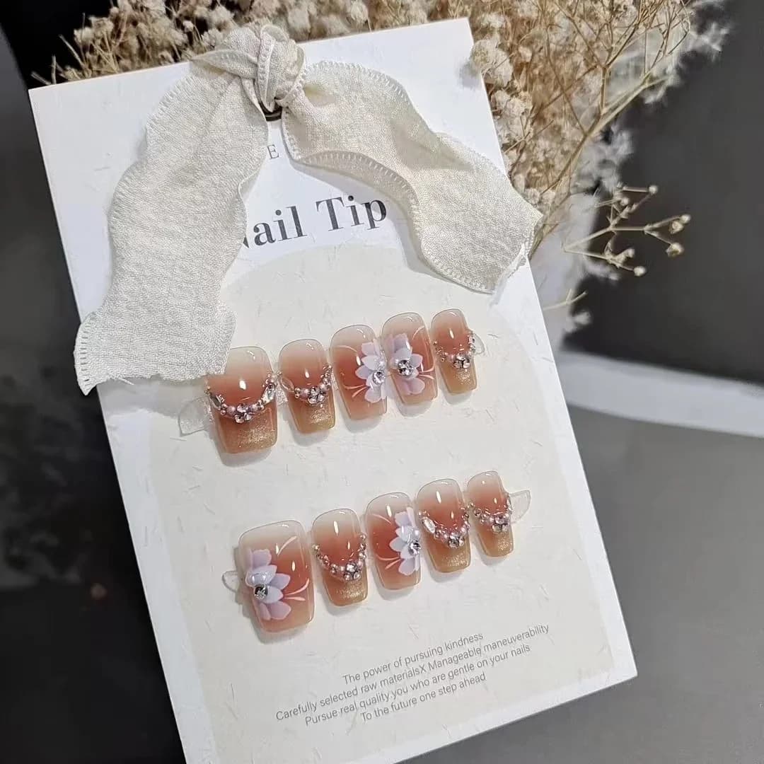 Lönnaglar med blommigt kattögon och stjärndesign