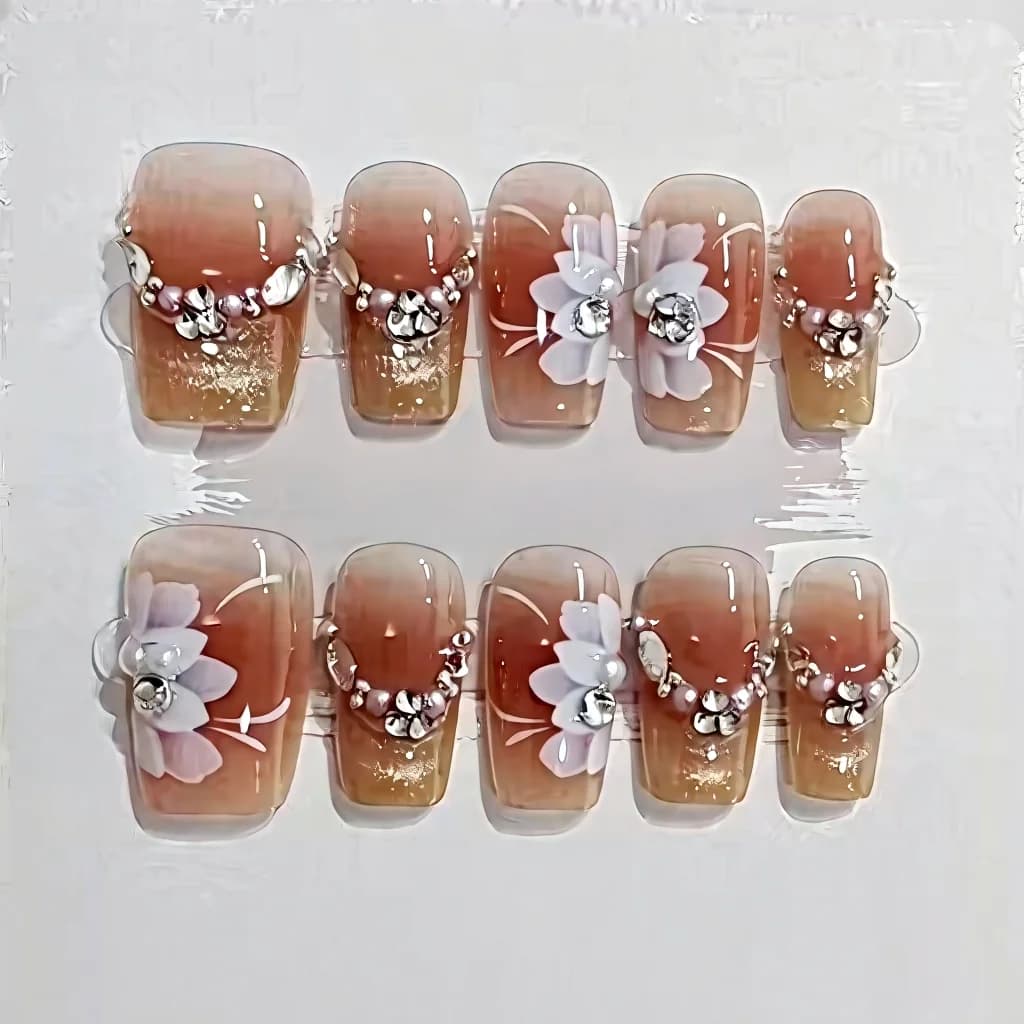 Lönnaglar med blommigt kattögon och stjärndesign